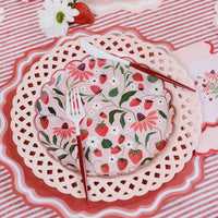 Strawberry Paper Plate styled with white cutlery and a strawberry for a Summer Picnic.