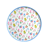 Round dessert plate with colorful spring wildflower pattern and blue rim