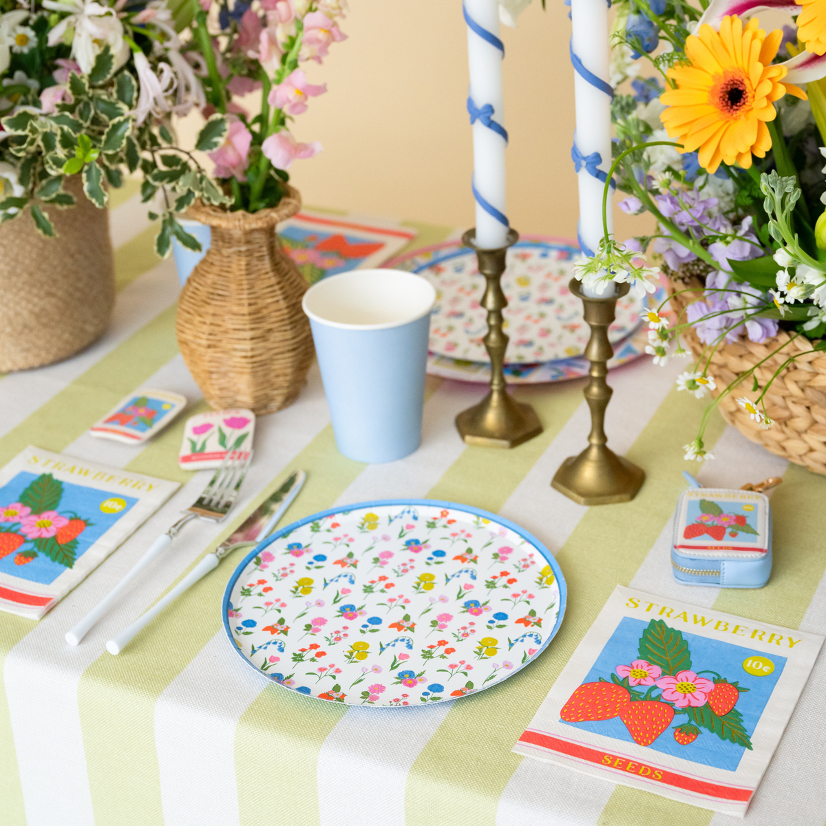 In Bloom floral dessert plate styled on a spring table with flowers and candles