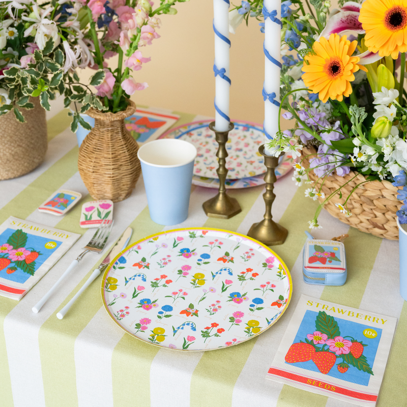In Bloom floral dinner plate styled on a spring table with flowers and candles
