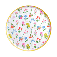 Round floral dinner plate with colorful spring flowers and yellow rim on white background
