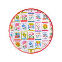 Round dessert plate with colorful vintage seed packet floral designs and coral rim on white background
