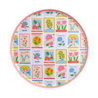 Round paper dinner plate with colorful vintage seed packet floral design and pink rim
