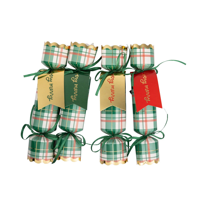 Isolated view of the plaid party crackers set, showing the green and red plaid pattern and gold foil tags.