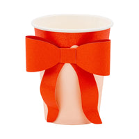 Isolated image of a single assembled bow cup showing the red bow attached to the pink cup body.