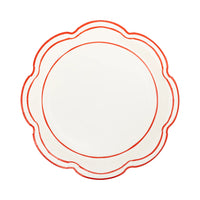 Isolated view of a single scalloped edge plate showing the cream color and red outline detail.