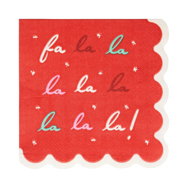 Close-up of a single Fa La La napkin showing the script text, snowflakes, and red scalloped edge.