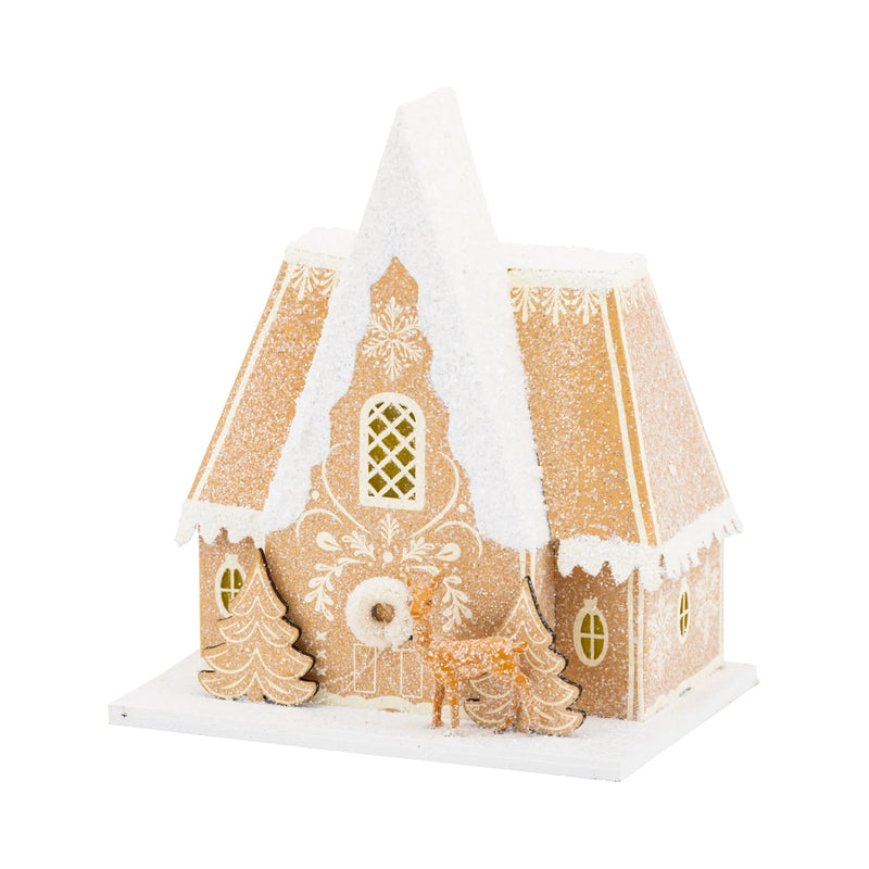 Isolated view of the Gingerbread Chalet putz house, showing the intricate frosting detail, high A-frame Christmas house roof, and attached glitter reindeer figure.