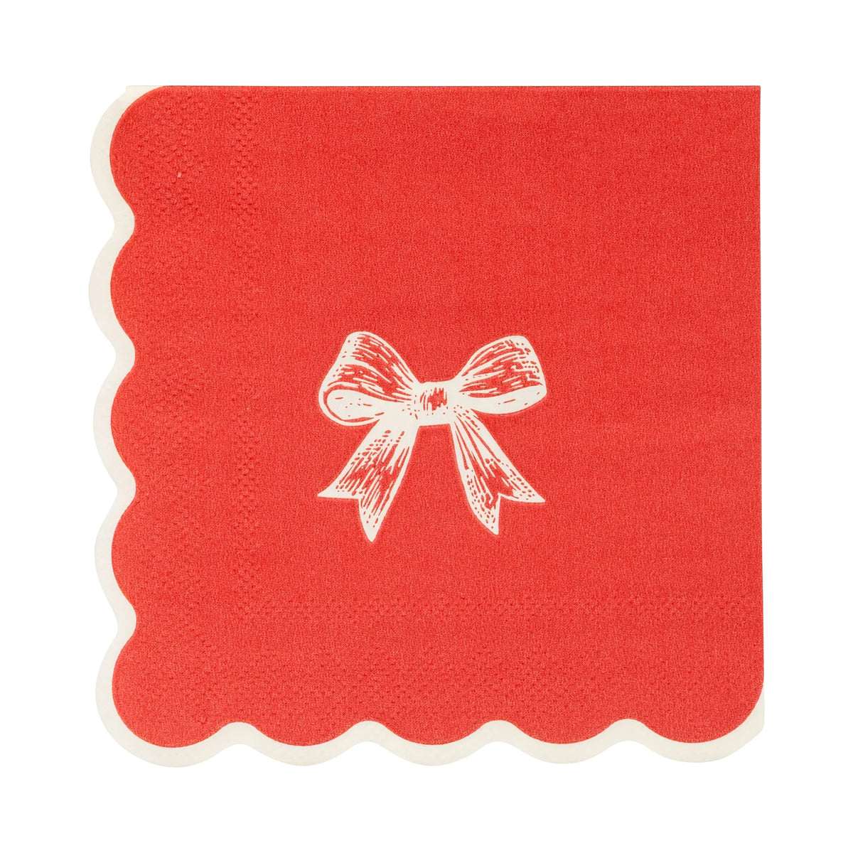 Isolated view of a single red paper cocktail napkin with a white illustrated bow and scalloped edge.