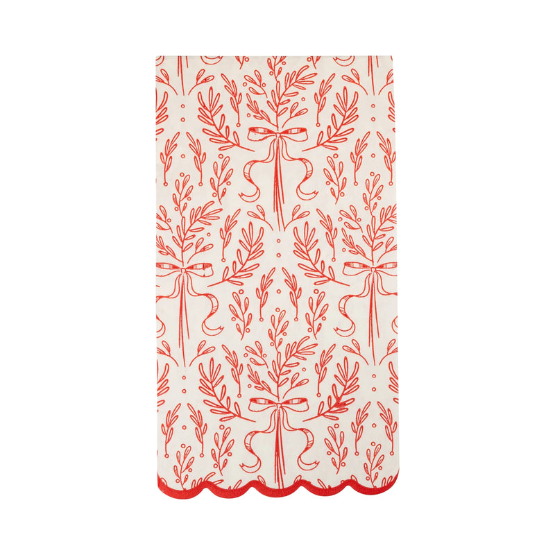 Isolated view of a single red and white napkin showing the continuous red bough illustration and scalloped edge.