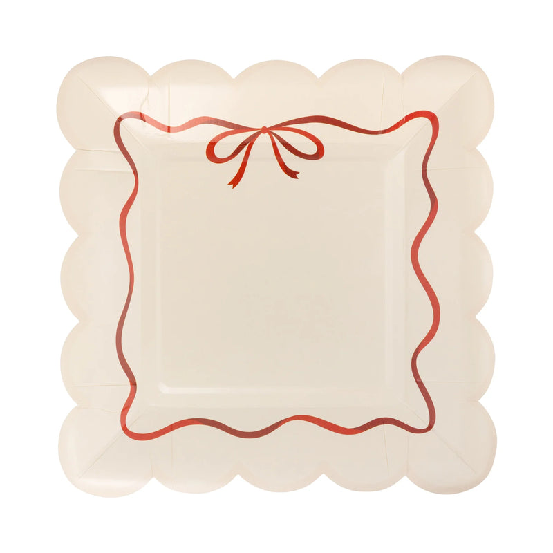 Isolated view of a single bow plate showing the red ribbon design and scalloped edge plates detail.