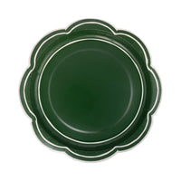 Isolated view of a single deep green scalloped plate showing the scalloped edge and double cream border line.