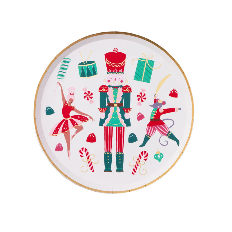 Isolated view of a single nutcracker plate showing the vibrant ballet-inspired illustrations and gold foil rim.
