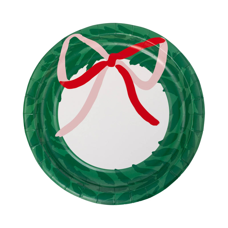 Isolated view of a single round wreath shaped plate showing the green wreath and red/pink bow design.