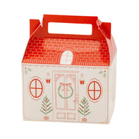 Isolated view of a single assembled Christmas cottage box showing the red tiled roof and front door illustration.