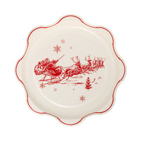 Isolated view of one paper Christmas plate featuring the Santa sleigh illustration.