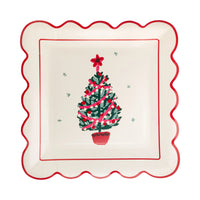 Decorative paper plate with a Christmas tree design on a white background