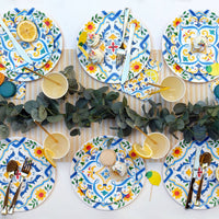 Italian themed table with colorful plates and cocktail napkins