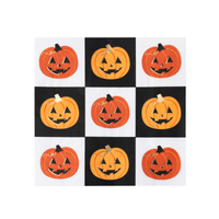 Jack-o-lantern paper napkin with orange pumpkins on a black and white checkerboard