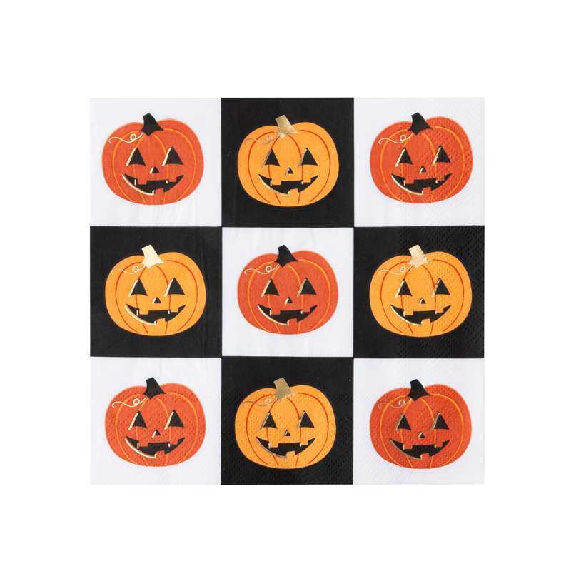 Jack-o-lantern paper napkin with orange pumpkins on a black and white checkerboard