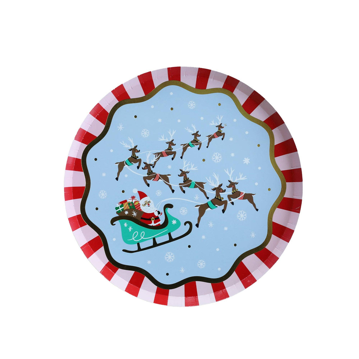 Round kids Christmas paper plate with Santa's sleigh and reindeer on a light blue night sky, framed by a red-and-white striped scalloped rim with green accents, overhead view on white background.