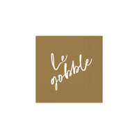Single kraft napkin printed with white “Le gobble” script, front view.