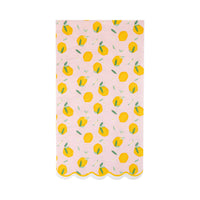 Pink paper napkin with yellow lemon pattern and scalloped edge