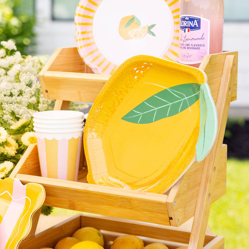 Lemon party setup with lemon plate in wooden stand display