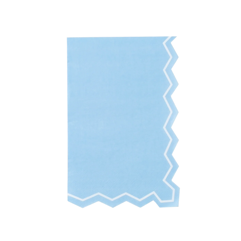 Full straight-on shot of a single light blue zigzag-edge paper guest towel centered on a white background. Portrait orientation. Right edge and bottom edge show the die-cut zigzag silhouette with white inset border line. Left edge and top are straight. Solid light blue field with slight matte paper texture.