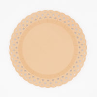 Overhead studio shot of a light brown 11.5 inch paper dinner plate featuring an embossed basketweave pattern and scalloped edges.