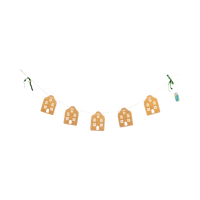 Light-up banner of five kraft-brown paper Christmas houses with green velvet bows and candy-cane accents on a white background.