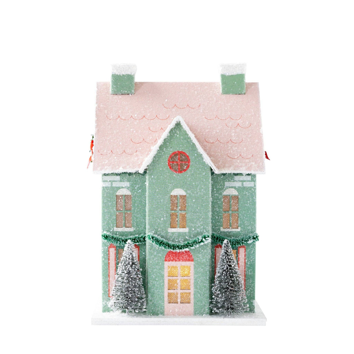 Mint paper house with windows and door glowing from the interior light on a white background