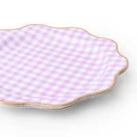 Stack of lilac gingham dinner plates with gold trim detail