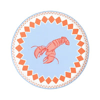 Full lobster paper plate on a white background, photographed straight-on. The entire design is clearly visible: periwinkle blue center ground with a large red-and-pink line-drawn lobster positioned diagonally with tail curving upward and claws extended downward. Orange diamond-check border creating a jagged inner edge. Pink dotted outer ring. Periwinkle blue plate edge.