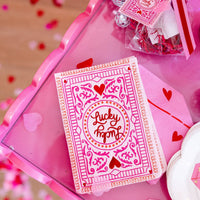 Lucky card napkin styled on a pink tray with party décor