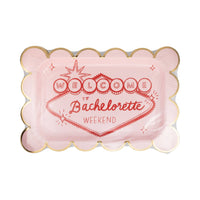 pack of pink and red scalloped paper plates for a Vegas bachelorette decor theme.