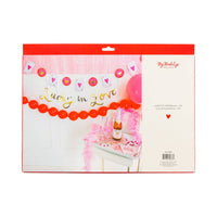 Packaging for a Vegas Bachelorette Decor banner set featuring gold foil lettering and heart playing cards.