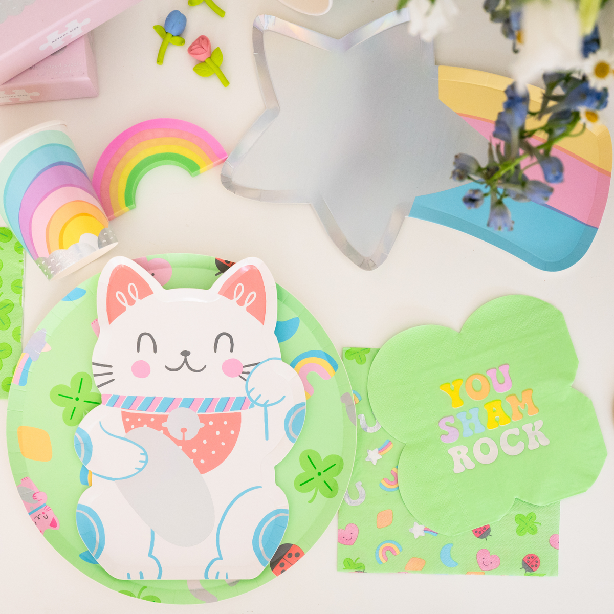 St Patrick’s Day table setup with Lucky Me napkins, plates, and rainbow accents