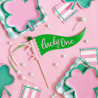 Lucky One felt pennant styled on St. Patrick’s Day party table with green and pink decor