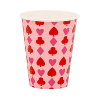 Pink paper party cup with red playing card suit pattern