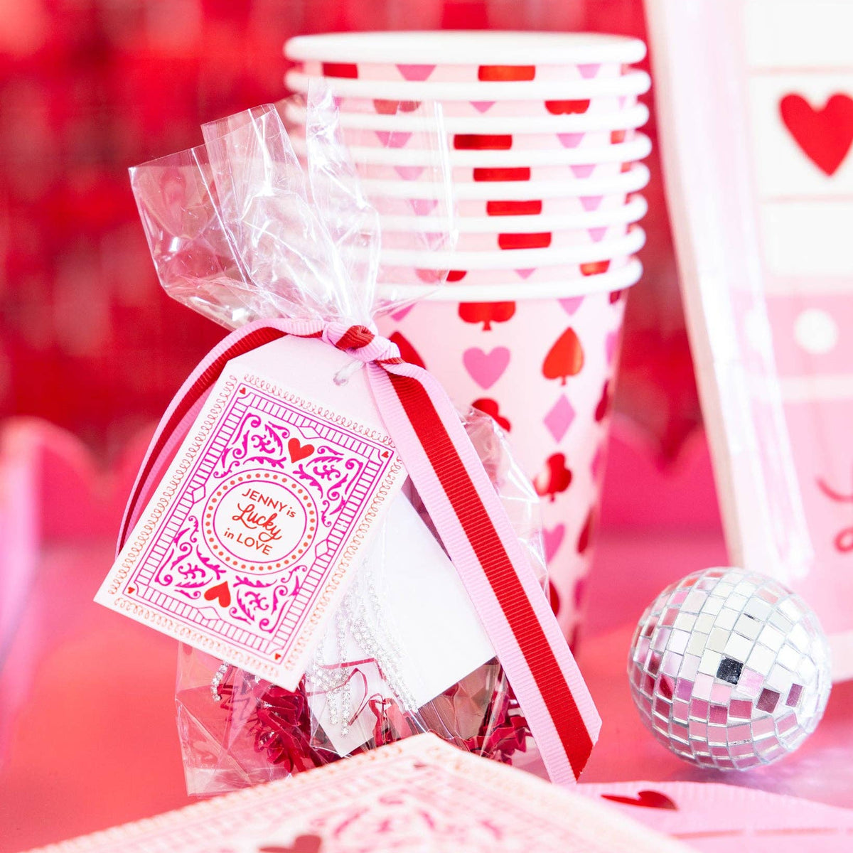 Stack of lucky party cups displayed on a Valentine drink table