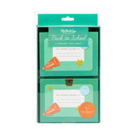 Front of lunchbox shaped treat box packaging in clear box with green "Back to School" label showing two treat boxes