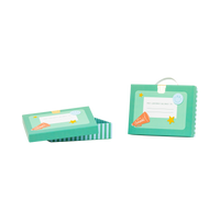 Two teal lunchbox shaped treat boxes shown on white background — one open with lid removed, one closed with ribbon handle