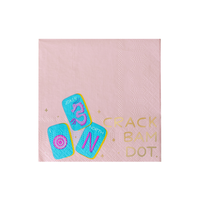 Single mahjong cocktail napkin in blush pink showing three pastel mahjong tile illustrations (Joker, North wind, Dot circle) with gold foil "CRACK BAM DOT" lettering and gold star accents