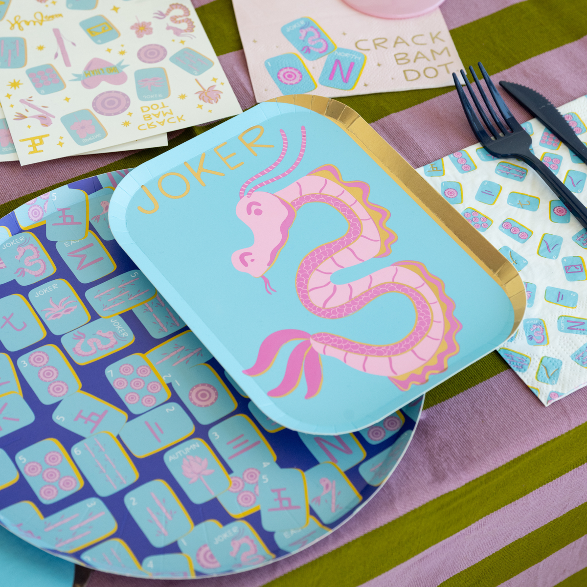 Mahjong print dinner plates styled on game night table with matching decor