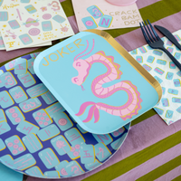 Mahjong print dinner plates styled on game night table with matching decor