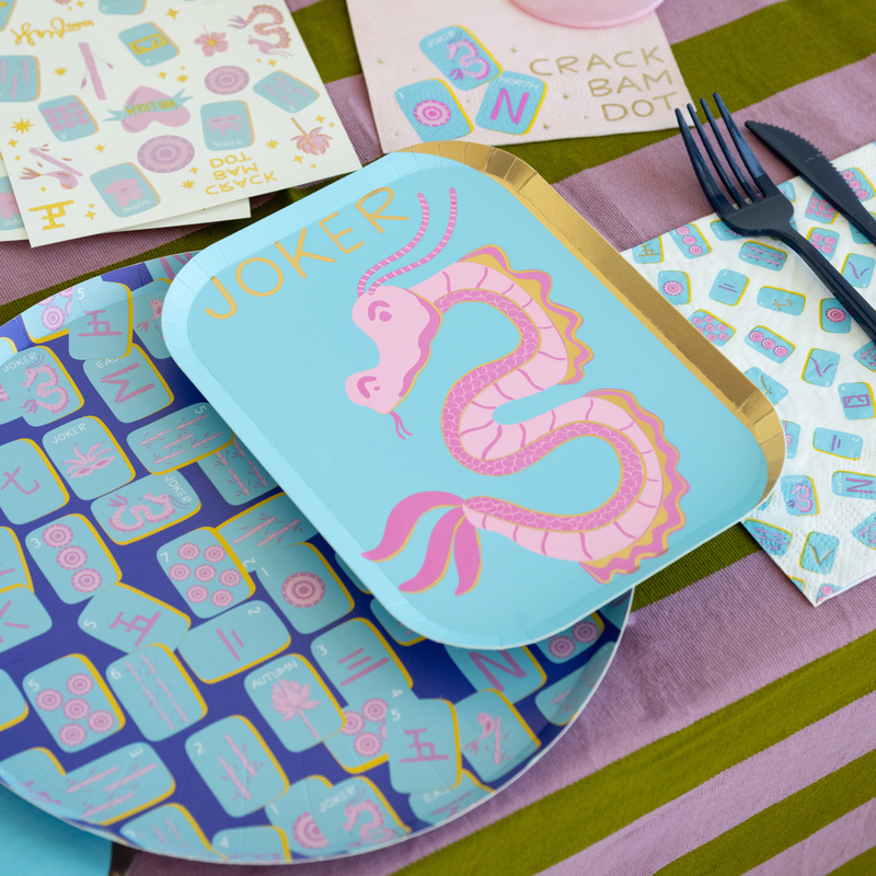 Mahjong print dinner plates styled on game night table with matching decor