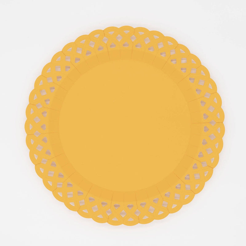 Bright marigold yellow basketweave dinner plate with an embossed woven texture and a scalloped lattice cutout border, overhead view on white background.