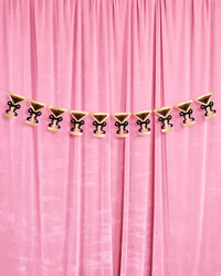 Full 5-foot martini glass banner pre-strung across pink velvet curtain with ten accordion pieces
