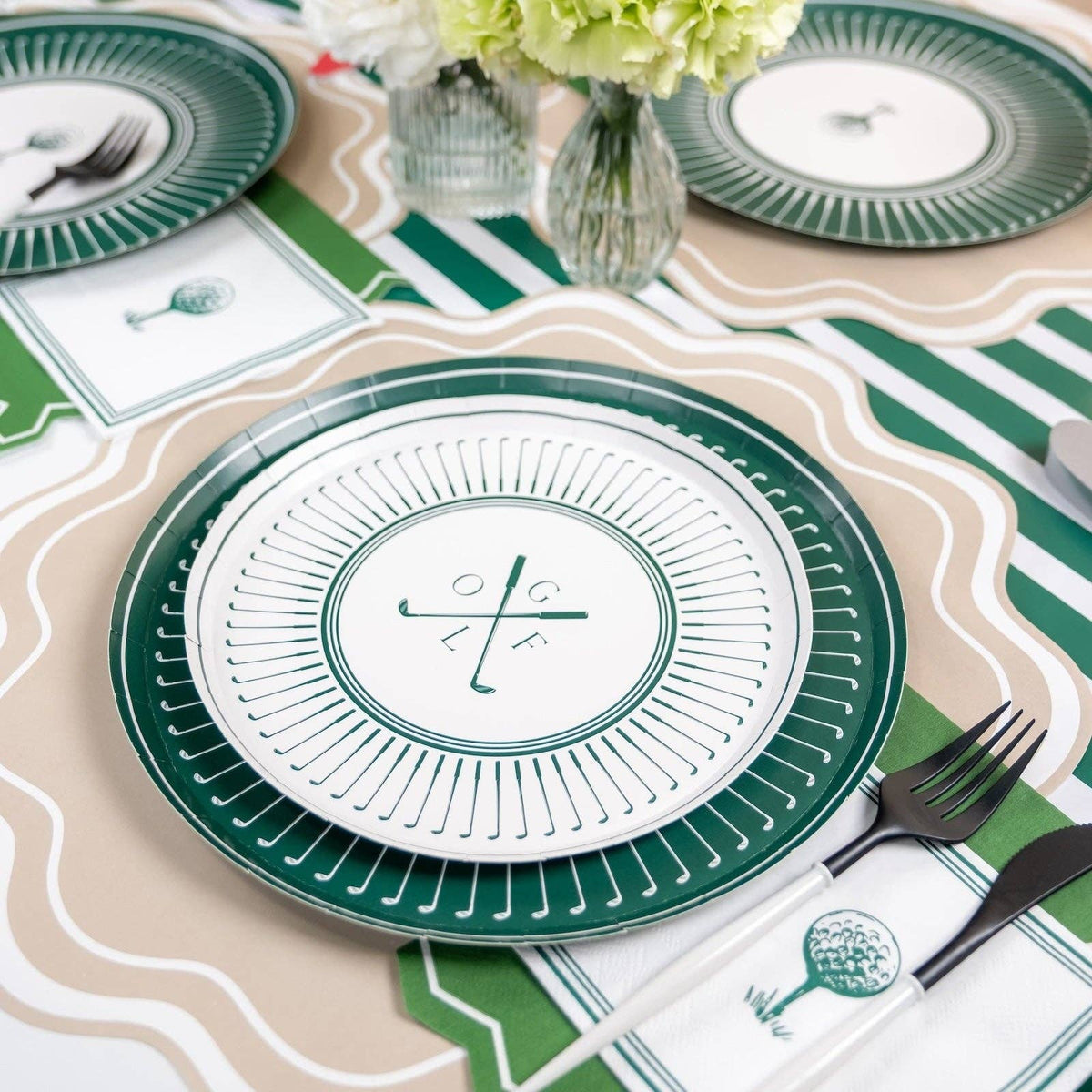 Masters party table with golf plates, flowers, and themed decor